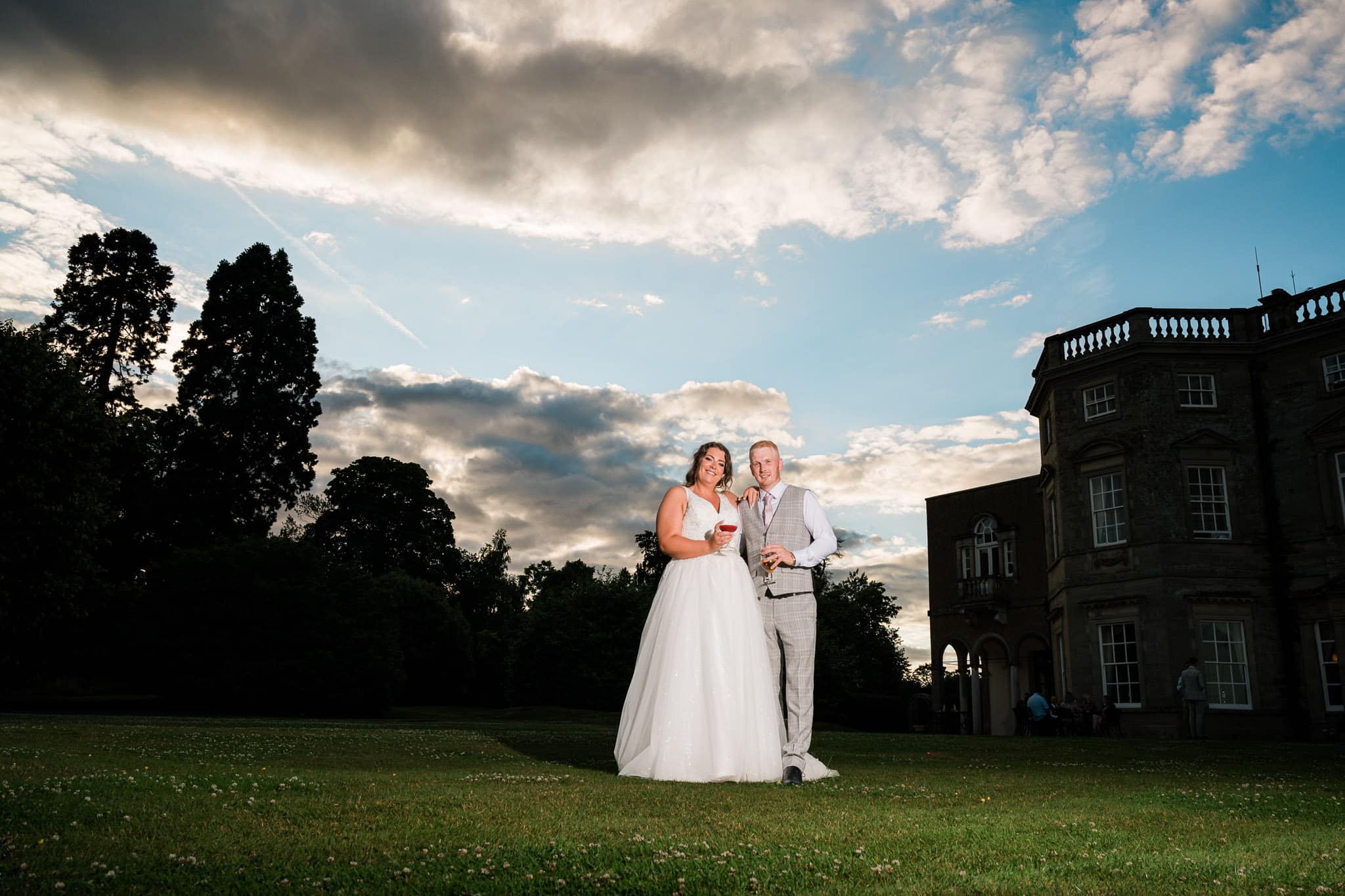 A romantic moment between the newlyweds is perfectly captured by Oliver Kershaw's skilled photography, with the impressive Bourton Hall as the backdrop.