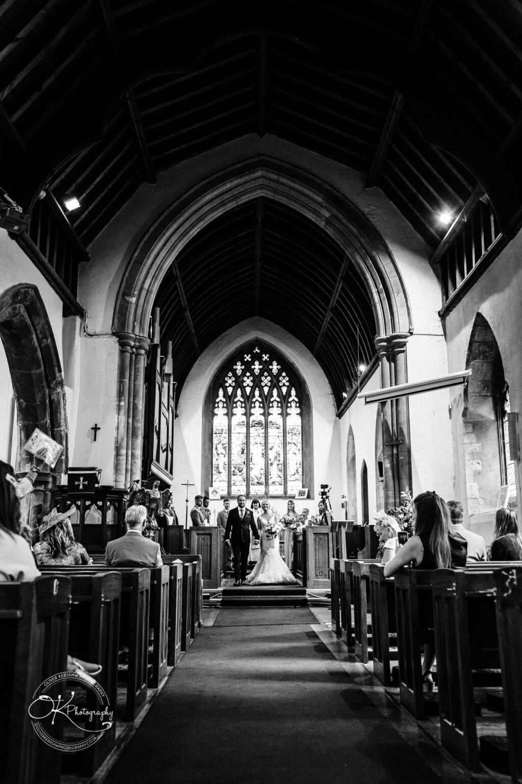 Married couple walking down the aisle at St Cuthberts Church Married couple walking down the aisle at St Cuthberts Church