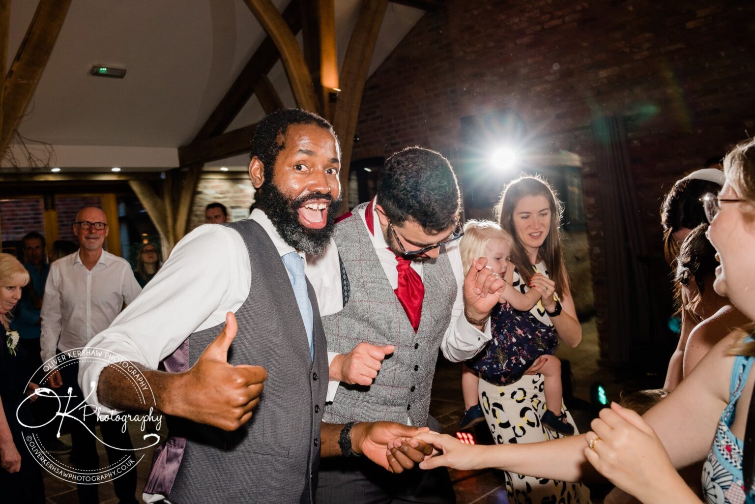 Guests dancing and enjoying the wedding reception at Swancar Farm.