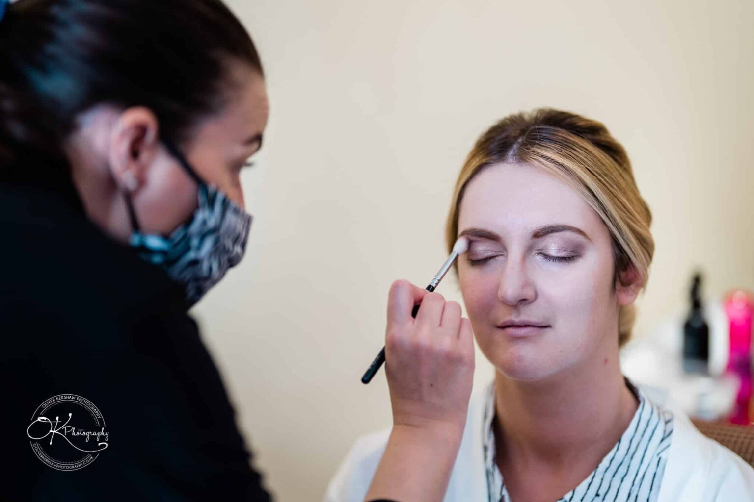 Yew Lodge Hotel Wedding Photography Bride having makeup applied before wedding at Yew Lodge Hotel.