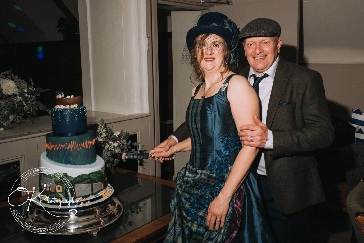 Wedding Photography George Hotel Stamford A couple in formal attire cutting a decorative wedding cake.