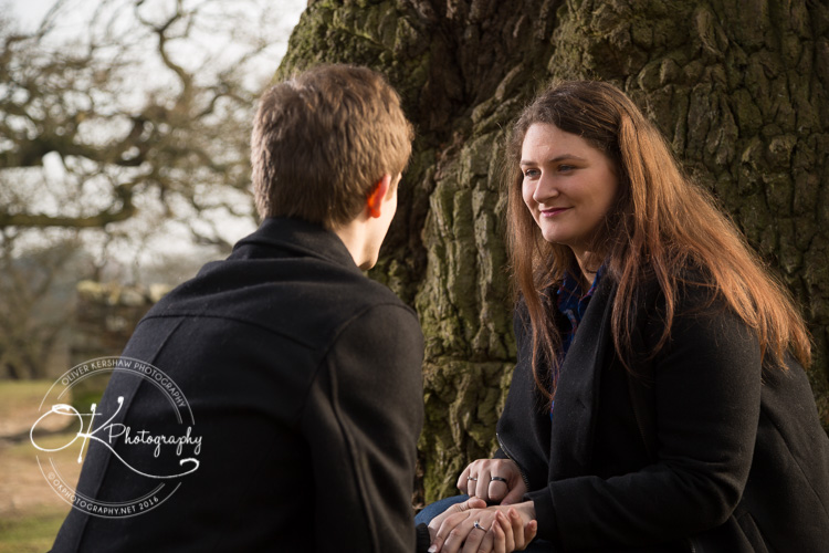 Kneeling by the tree