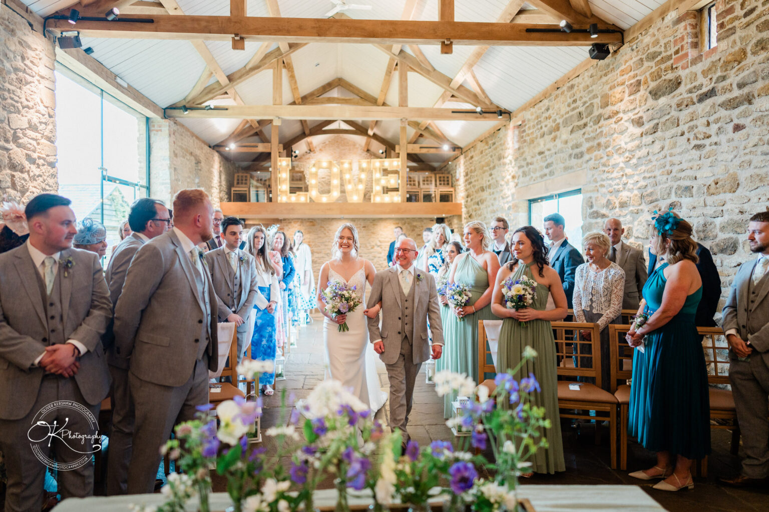 Bride walking down the aisle with her father at Dodford Manor