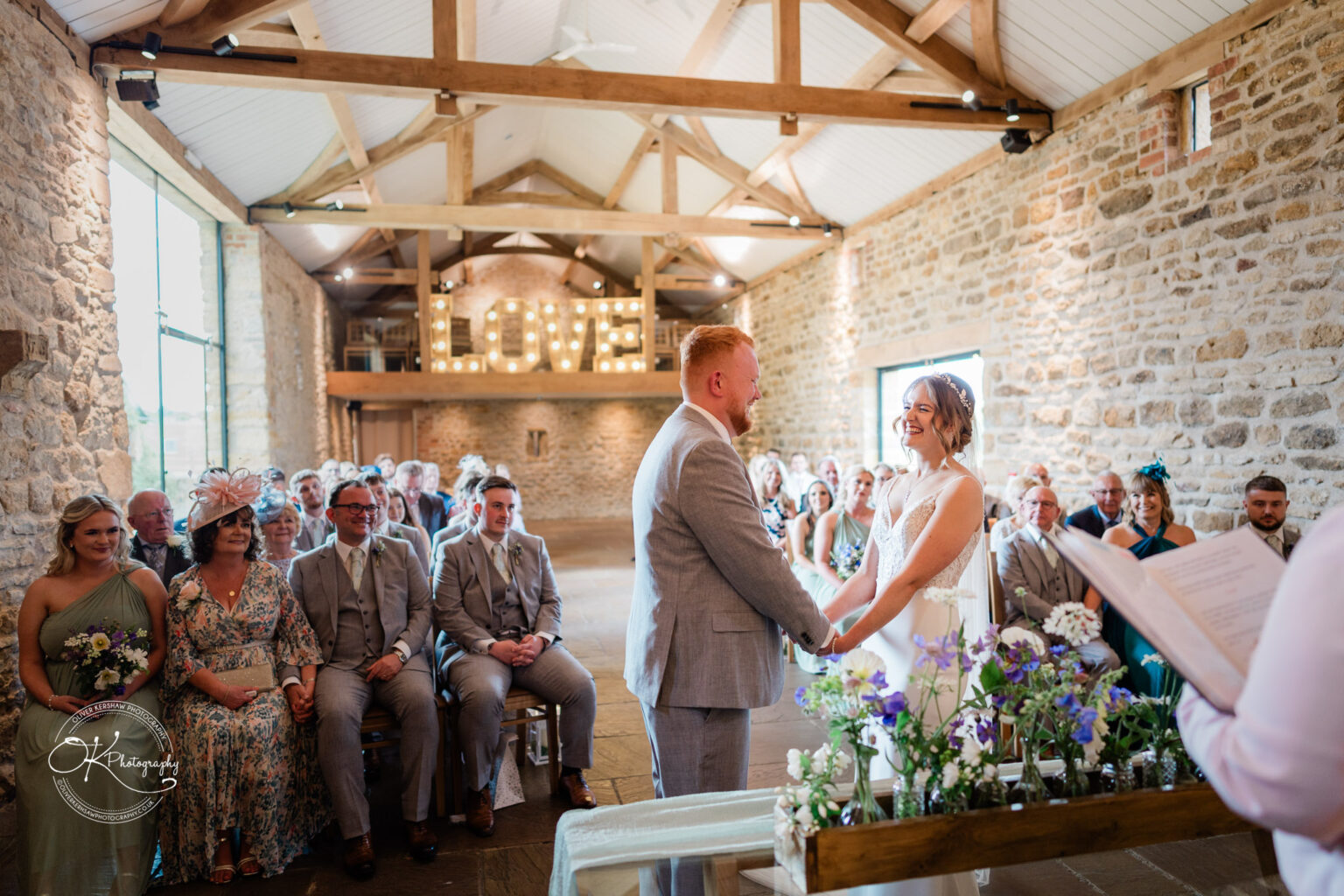 Bride and groom exchanging vows at Dodford Manor