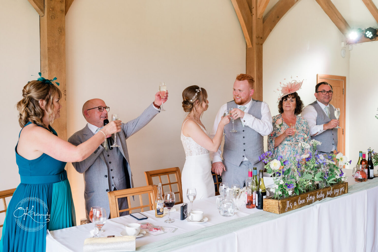Wedding toast with the bride, groom, and family at Dodford Manor