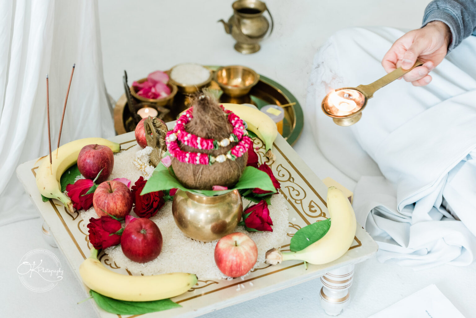 Traditional Hindu wedding offerings and ceremonial items arranged on a tray.