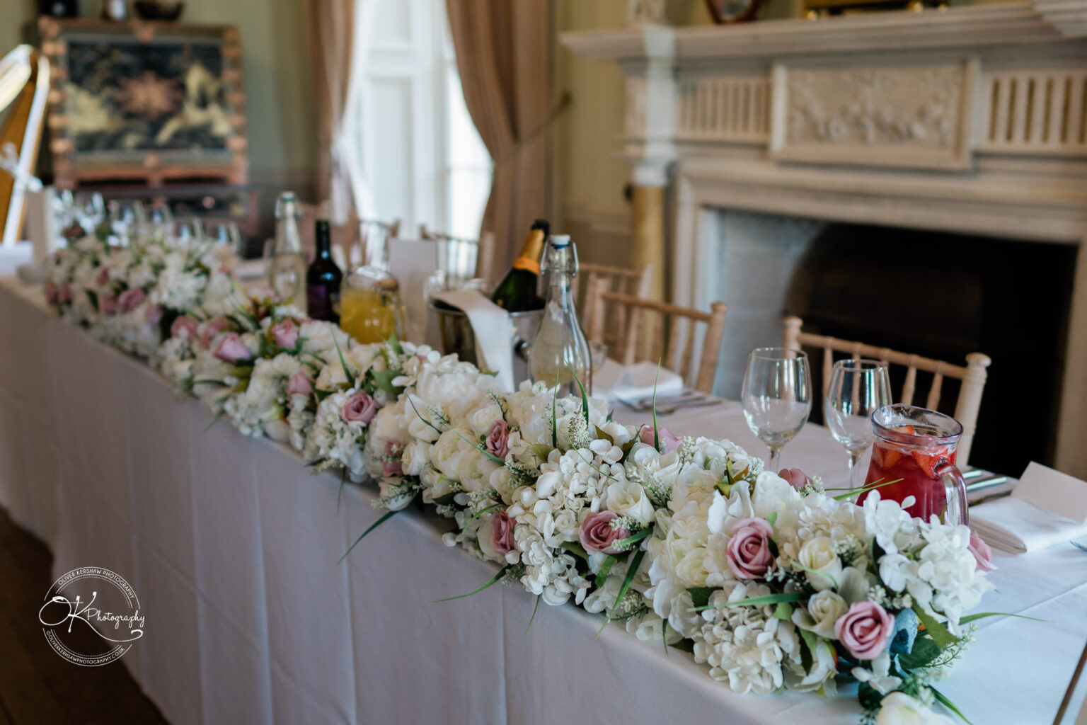 Floral decoration on the wedding table at Prestwold Hall.