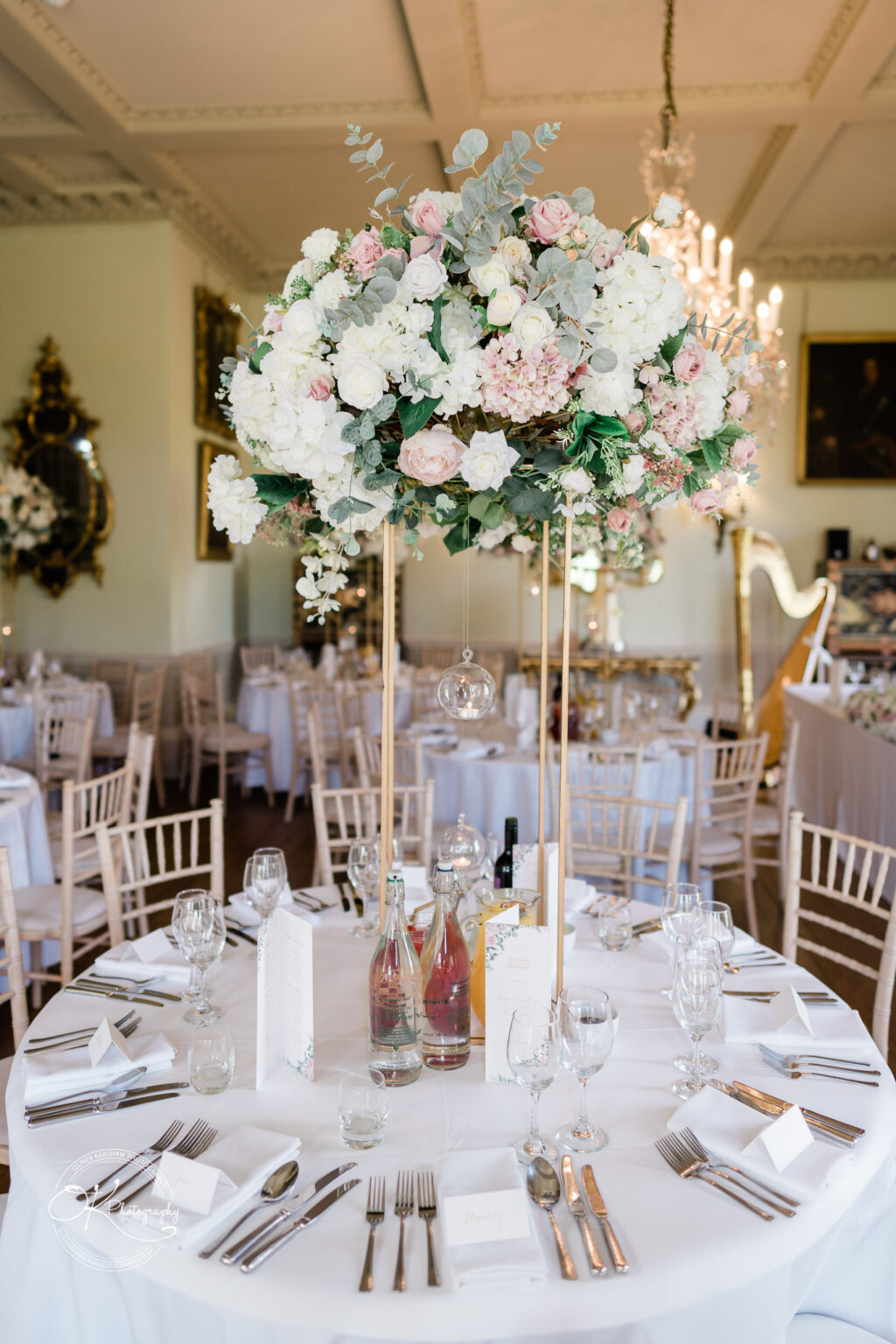 Beautiful floral centerpiece at the wedding reception in Prestwold Hall.