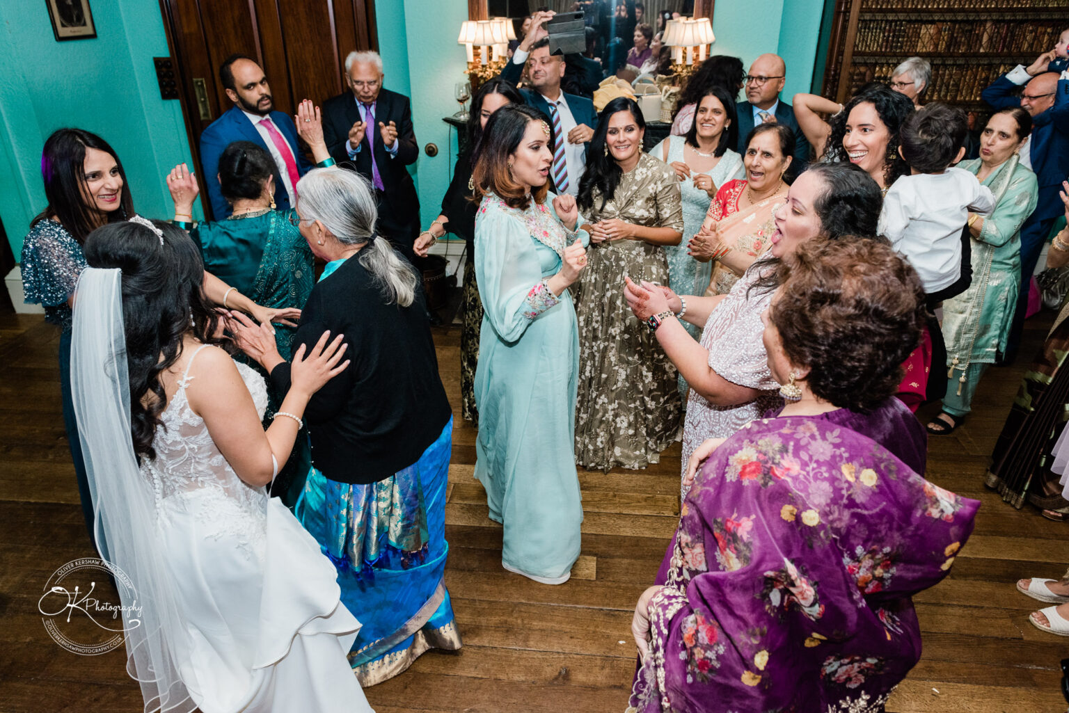 Guests enjoying the wedding reception inside Prestwold Hall.